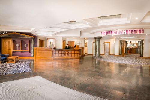 a large room with a lobby with a reception desk at Copthorne Hotel Merry Hill Dudley in Dudley