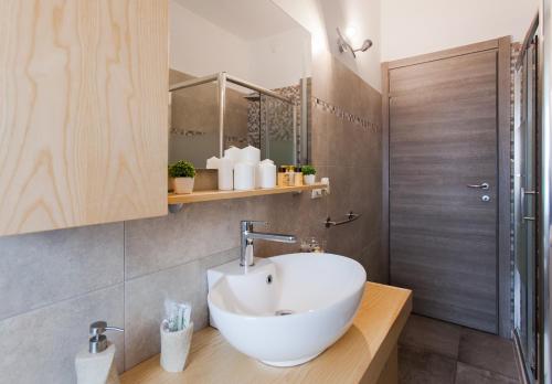 a bathroom with a white sink and a shower at Bongiorno Home Private Free Parking Venice 10' in Marghera
