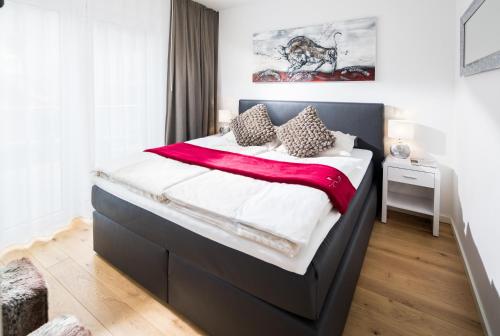 a bedroom with a large bed in a room at Gartenpalais 2 in Norderney