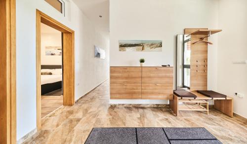 a room with a bed and a desk and a mirror at Apartment Sandro in Vilanija