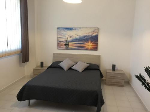 Ένα ή περισσότερα κρεβάτια σε δωμάτιο στο Holiday Home Fontana Greca