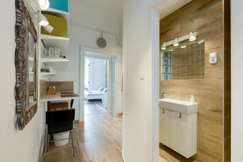 a small bathroom with a sink and a counter at Buda Castle Apartment in Budapest