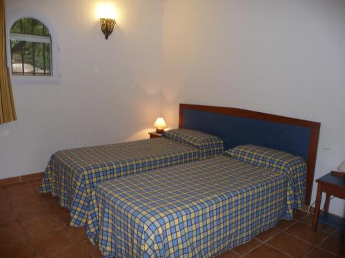 Krevet ili kreveti u jedinici u objektu Villa Les Hameaux Di Santa Giulia