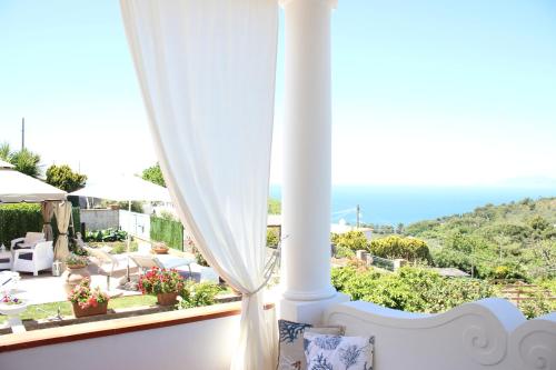 a room with a view of the ocean from a house at B&B Villa Cristina in Anacapri