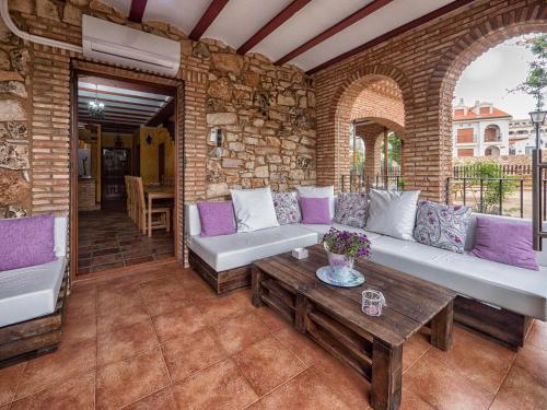 an outdoor living room with couches and a table at El Mirador De Ruidera in Ruidera