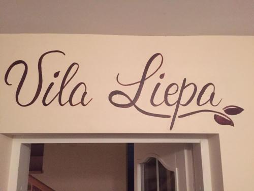 a sign that reads villa iecca on a wall at Vila Liepa in Birštonas