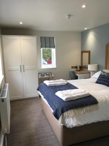 Ένα ή περισσότερα κρεβάτια σε δωμάτιο στο The Pityme Inn