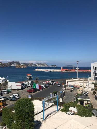 a parking lot next to a body of water at Porto di Ponza - Immobilevante in Ponza