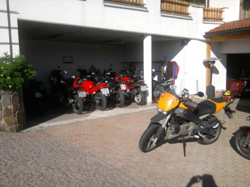 a row of motorcycles parked in a garage at Gasthof Specker in Obereggen