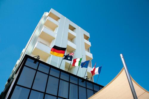 a building with several flags on top of it at San Marco in Marotta