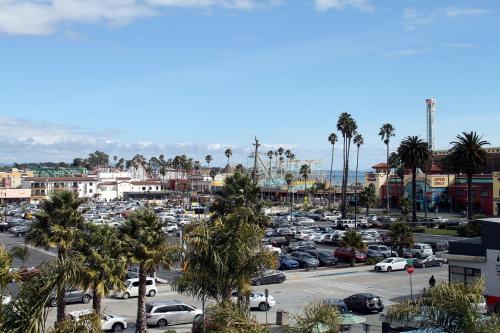 a city with cars parked in a parking lot at Fireside Inn By The Beach Boardwalk & Bowling in Santa Cruz