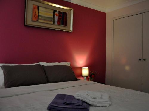 Cama o camas de una habitación en TL Warmest Homestay
