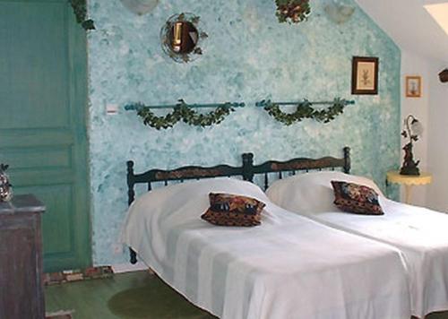 Postelja oz. postelje v sobi nastanitve Ferme les Rousseaux