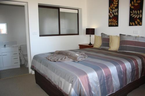 A bed or beds in a room at Bay View Holiday Village