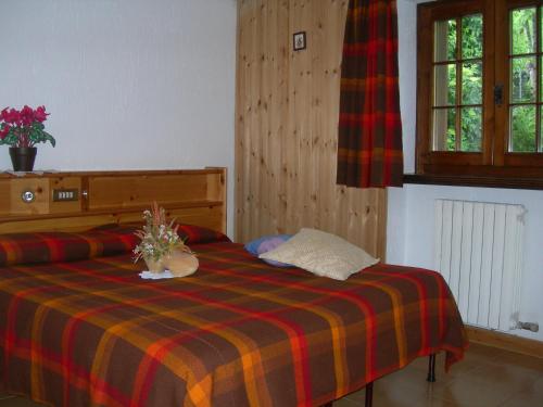 Postel nebo postele na pokoji v ubytování Agriturismo Lo Ratelé