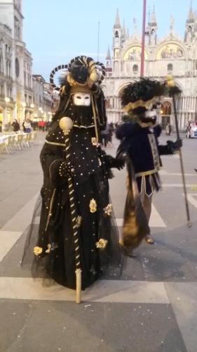 two people dressed in medieval costumes on a city street at B&B Terre Di Bea in Pederobba