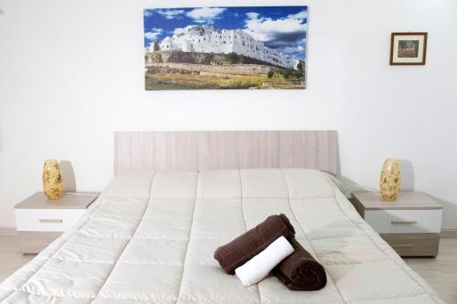 Un pat sau paturi într-o cameră la Domus Relax