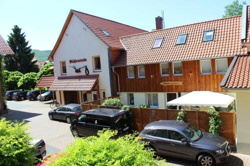 a group of cars parked in front of a building at Apart Hotel Wernigerode in Wernigerode