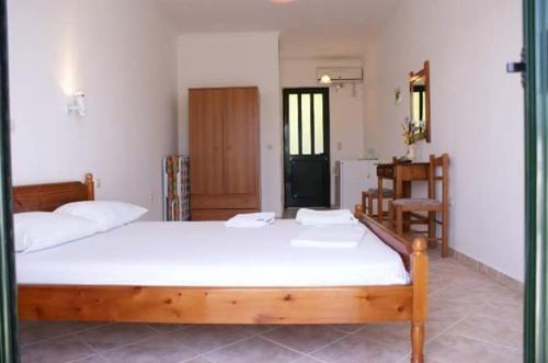 Postel nebo postele na pokoji v ubytování Santas Rooms