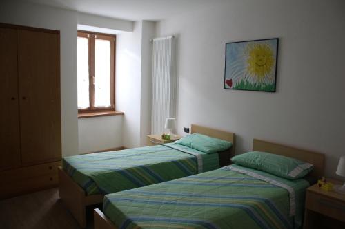 Postel nebo postele na pokoji v ubytování La Casa della Coccinella