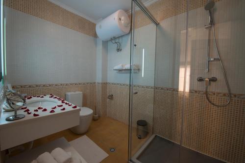 Ett badrum på Hotel de Charme