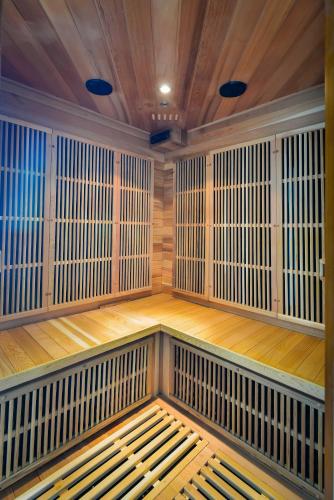 a sauna with a bench in the middle of a room at Pegasus Hotel Shah Alam in Shah Alam