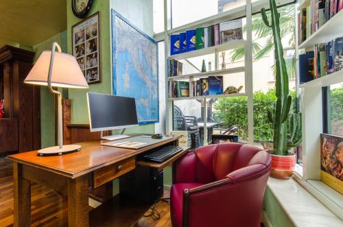 an office with a desk with a computer and a chair at Hotel Ovidius in Sulmona