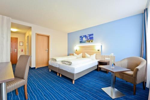 Llit o llits en una habitació de Hotel Am Freischütz