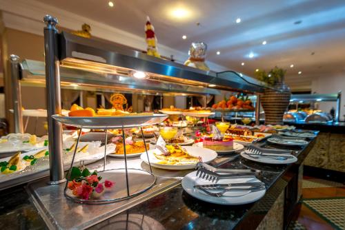 a buffet line with many different types of food at Kennedy Hospitality Resort in Marrakech