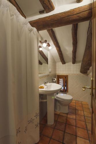 a bathroom with a sink and a toilet at Casa Trallero in Almazorre