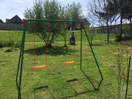 an empty swing set in a yard at VIP Apartments & Room in Rakovica