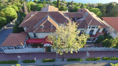 an overhead view of a house with red roof at Pansion Ruža in Novi Vinodolski
