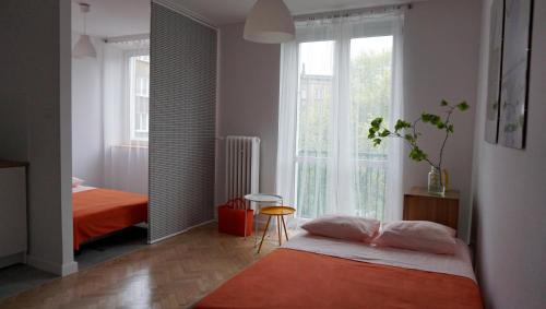 Posteľ alebo postele v izbe v ubytovaní Lovely Jubbly Apartment