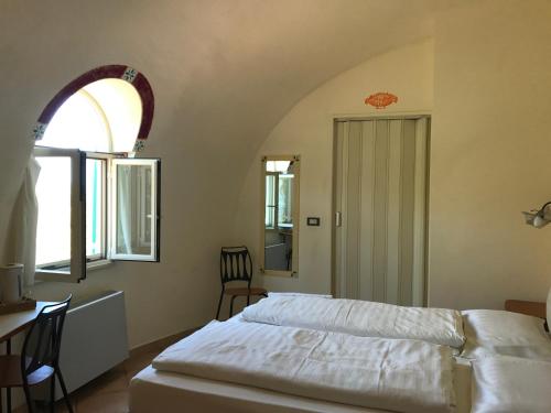 Säng eller sängar i ett rum på Giardino Di Sicilia