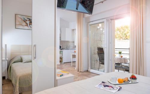 Tempat tidur dalam kamar di Ragusina luxury apartments