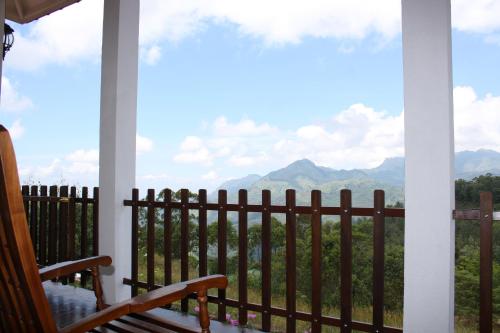 a porch with a view of the mountains at Ella Repose in Ella