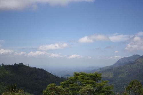 a view of a valley with trees and mountains at Ella Repose in Ella