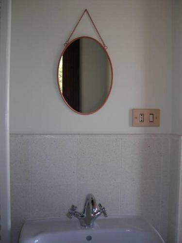 a bathroom with a mirror above a sink at De Vita Beata Agriturismo in Veroli