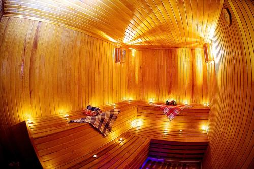 a sauna with a wooden floor with lights on it at Gülhanepark Hotel & Spa in Istanbul