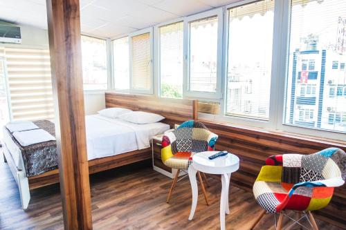 Ένα ή περισσότερα κρεβάτια σε δωμάτιο στο Ale Boutique Apartments