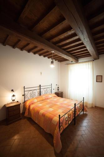 Ένα ή περισσότερα κρεβάτια σε δωμάτιο στο Agriturismo Casone
