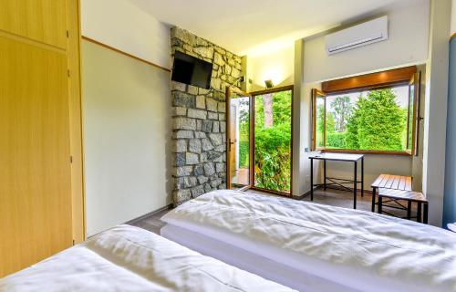 Postel nebo postele na pokoji v ubytování Hotel Bungalows Europa