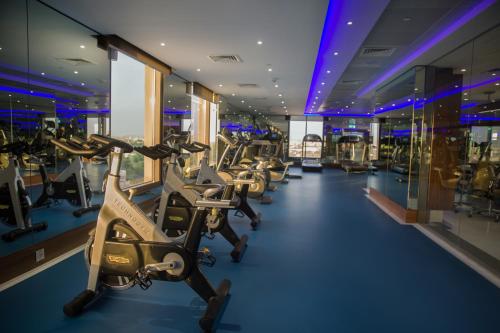 a row of exercise bikes in a gym at Ayla Grand Hotel in Al Ain