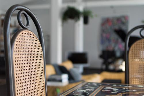 a close up of the back of a table and chairs at Weimar Central Artist Loft - 120 m2 in Weimar