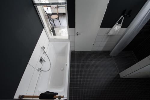 an overhead view of a bathroom with a shower at Weimar Central Artist Loft - 120 m2 in Weimar