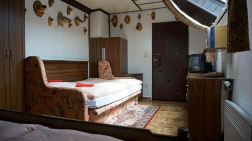 Un pat sau paturi într-o cameră la Pension Karolína