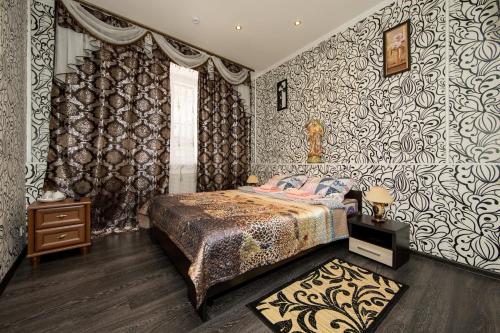 モスクワにあるHotel Ladomir na Sadovomのベッドルーム1室(ベッド1台付)