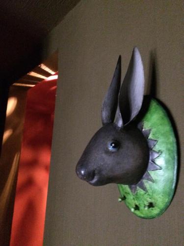 a head of a rabbit hanging on a wall at Des goûts et des couleurs in Verviers