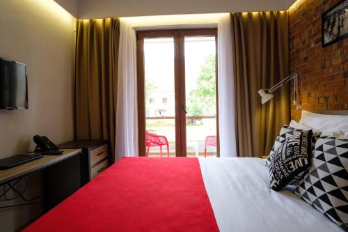 SL Industry Hotelにあるベッド