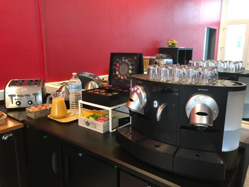 a coffee machine sitting on a counter in a room at Hotel De L'Europe in Toul
